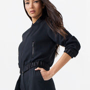 Woman wearing a black outfit on a white background