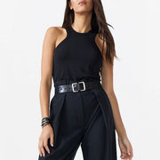 Woman wearing a black sleeveless jumpsuit on a white background